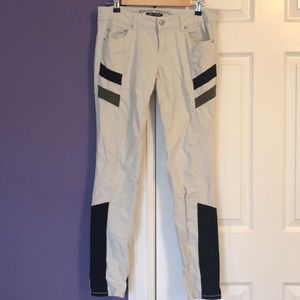 Green, black, and beige Almost Famous skinny jeans